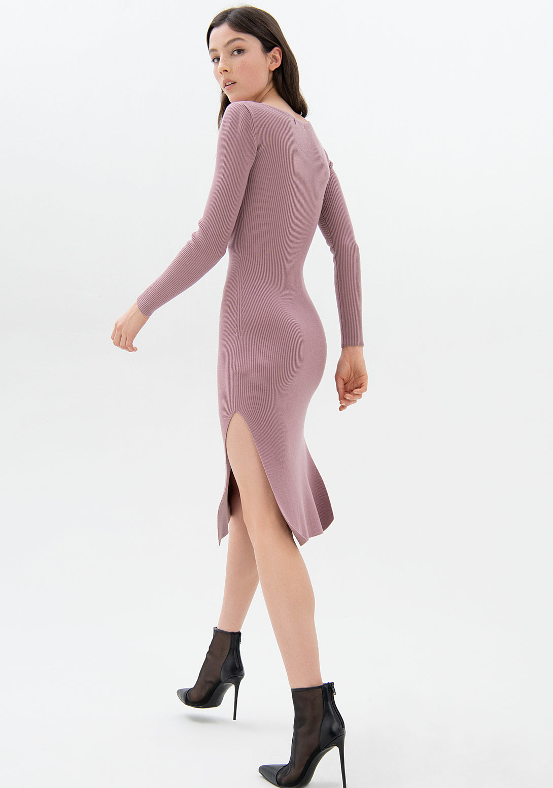 Knitted dress tight fit made in wool with rib stitch